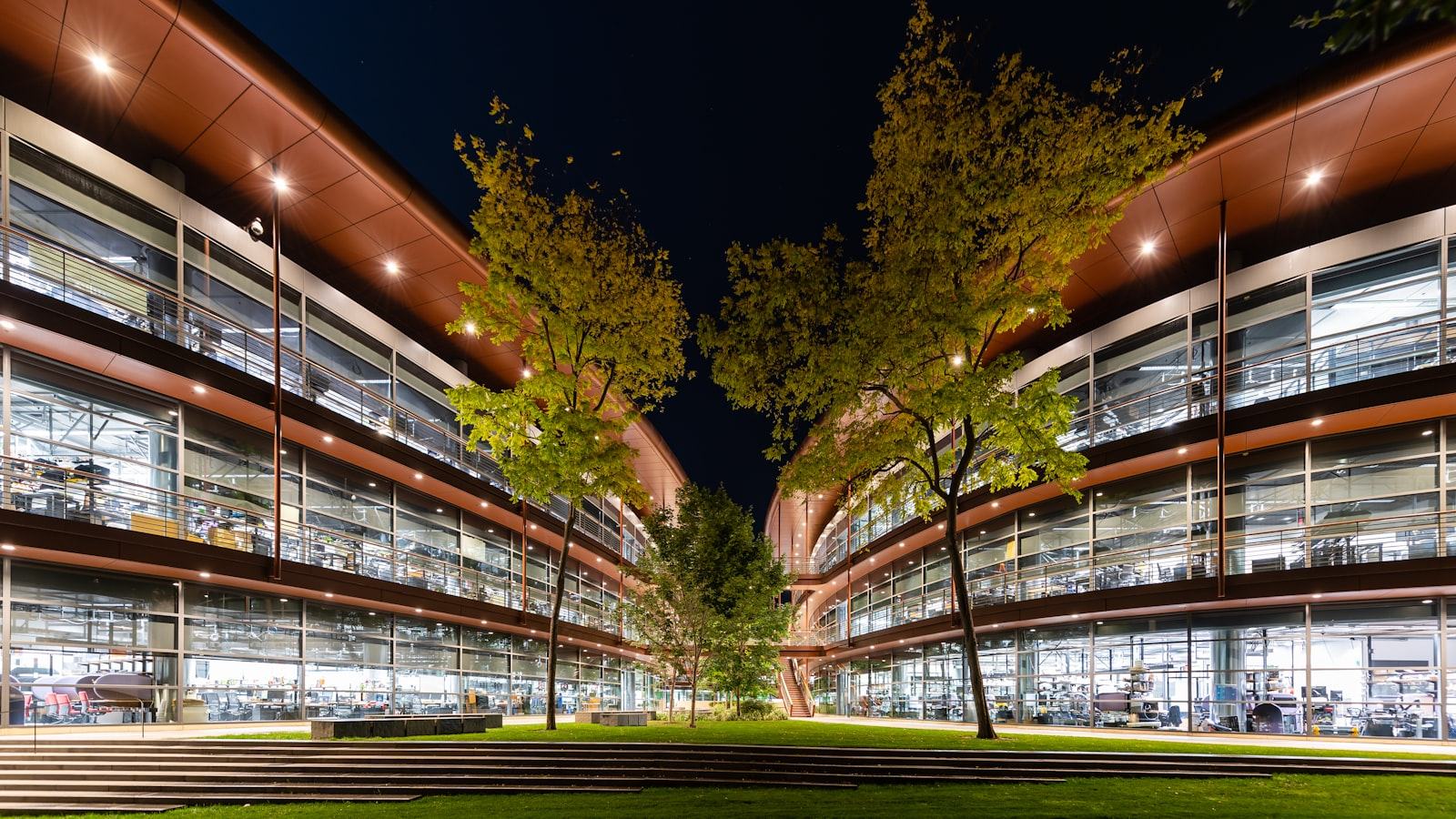 Modern university campus building illuminated at night