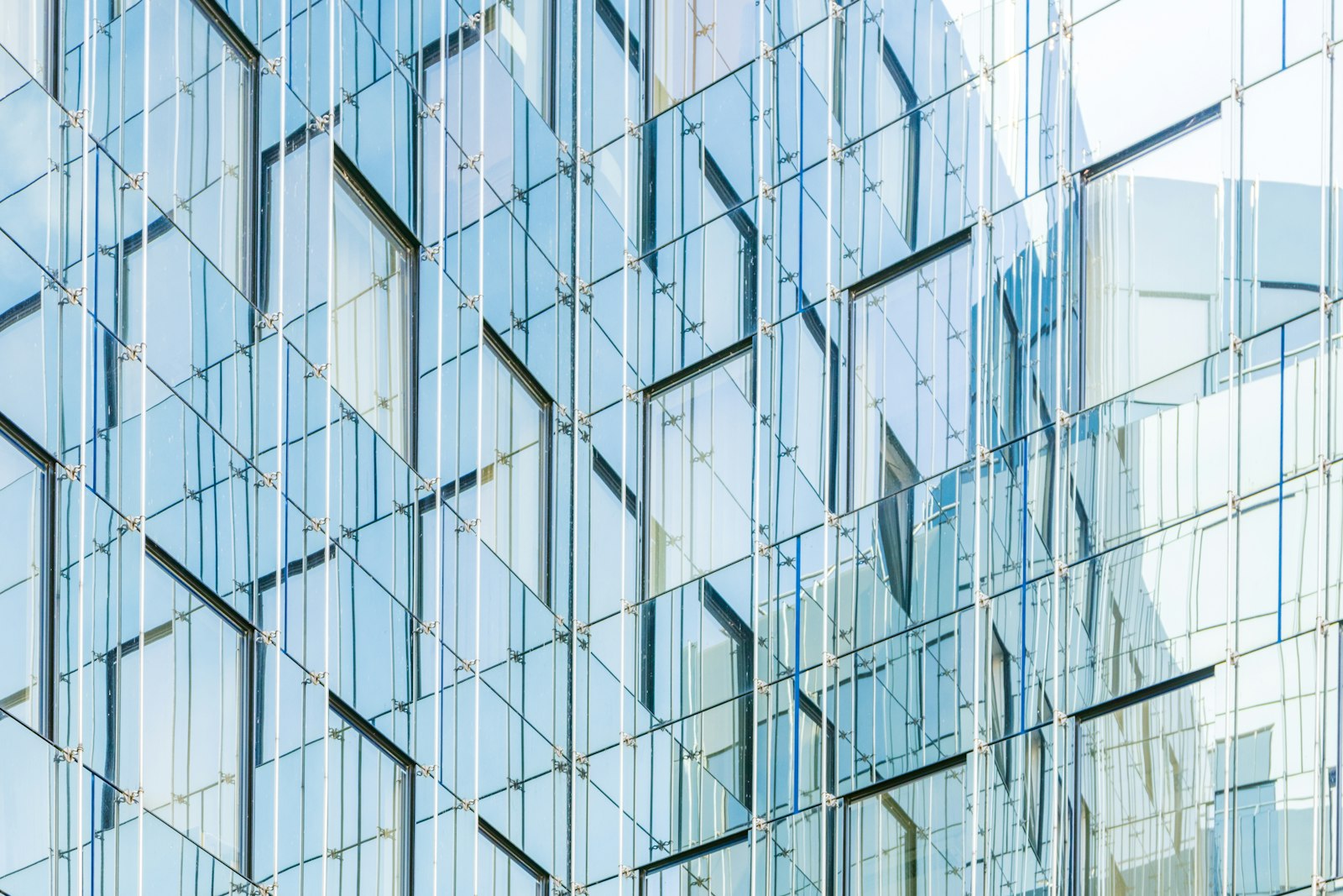 Planning session viewed through a modern glass facade
